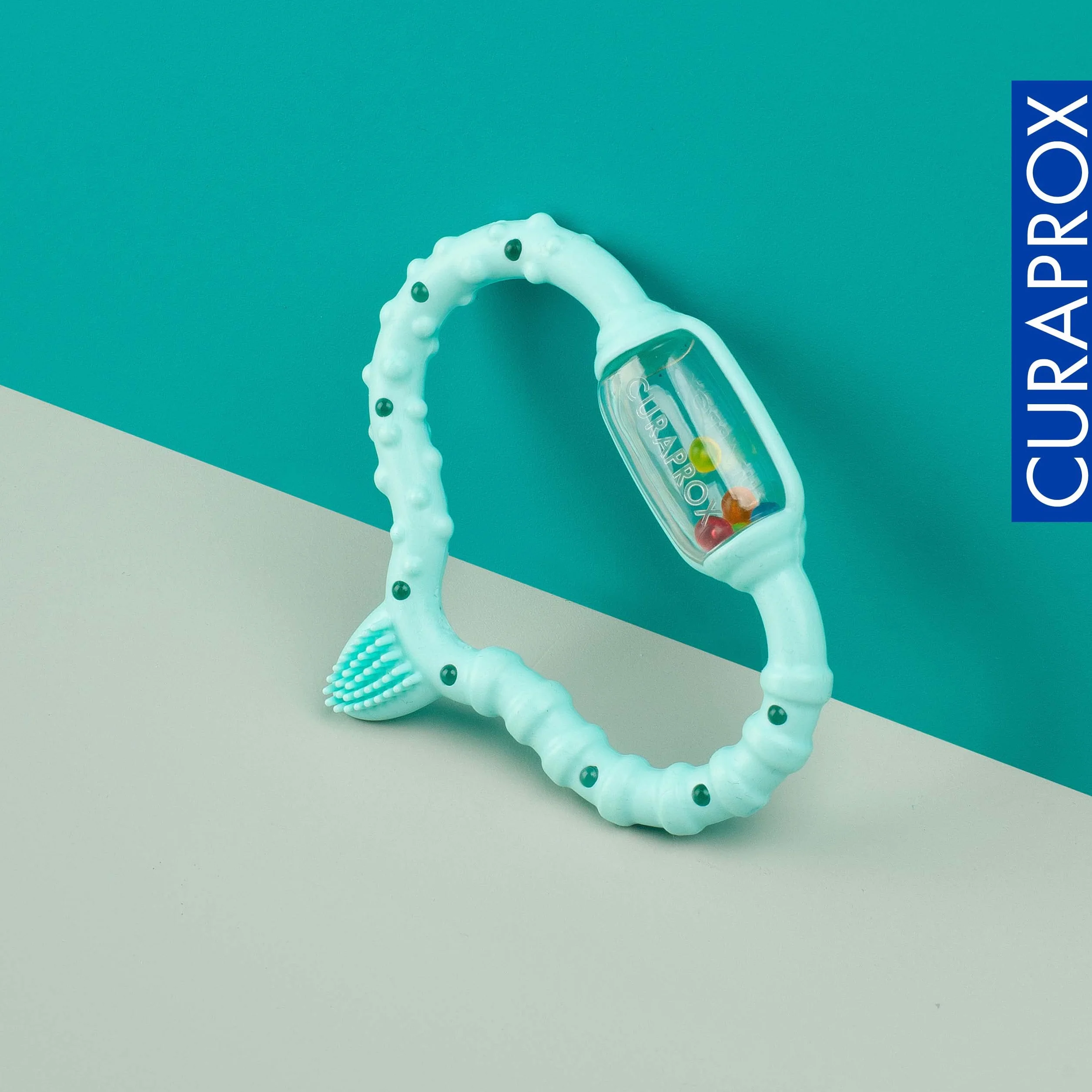 Curaprox Baby ząbkowany Pierścień-Dla Niemowląt 0-24 miesięcy/łagodzi dyskomfort ząbkowania i stymuluje rozwój sensoryczny | bez BPA, turkusowy, ze szczoteczką treningową/Made in Switzerland